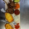 Каре ягненка с запеченным картофелем и соусом